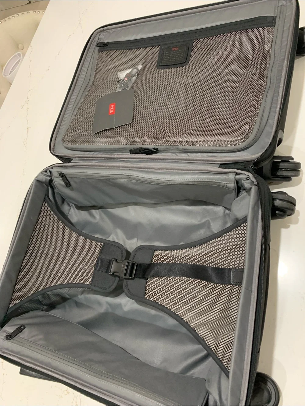 Tumi Black Spinner Carry-On with Front Zip Pocket luggage